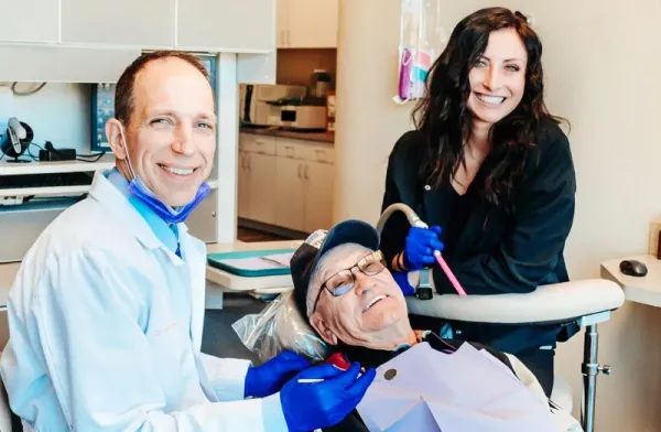 Dr. Gailey and a team member treating a patient at Gateway Family Dentistry